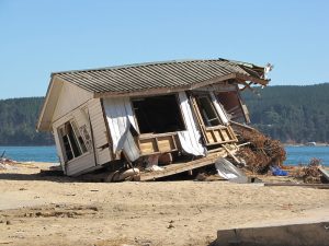 This photo shows a completely destroyed house at the beach